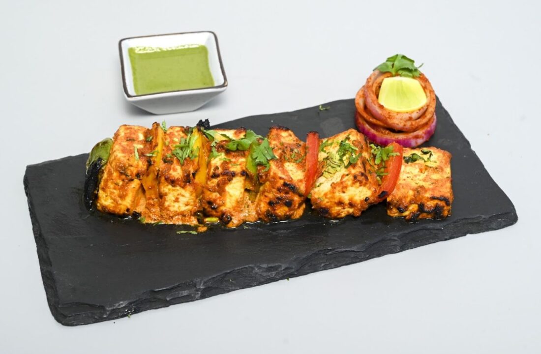 Paneer tikka on slate with mint chutney at Nouba Restaurant and Rooftop Lounge, C-Scheme Jaipur