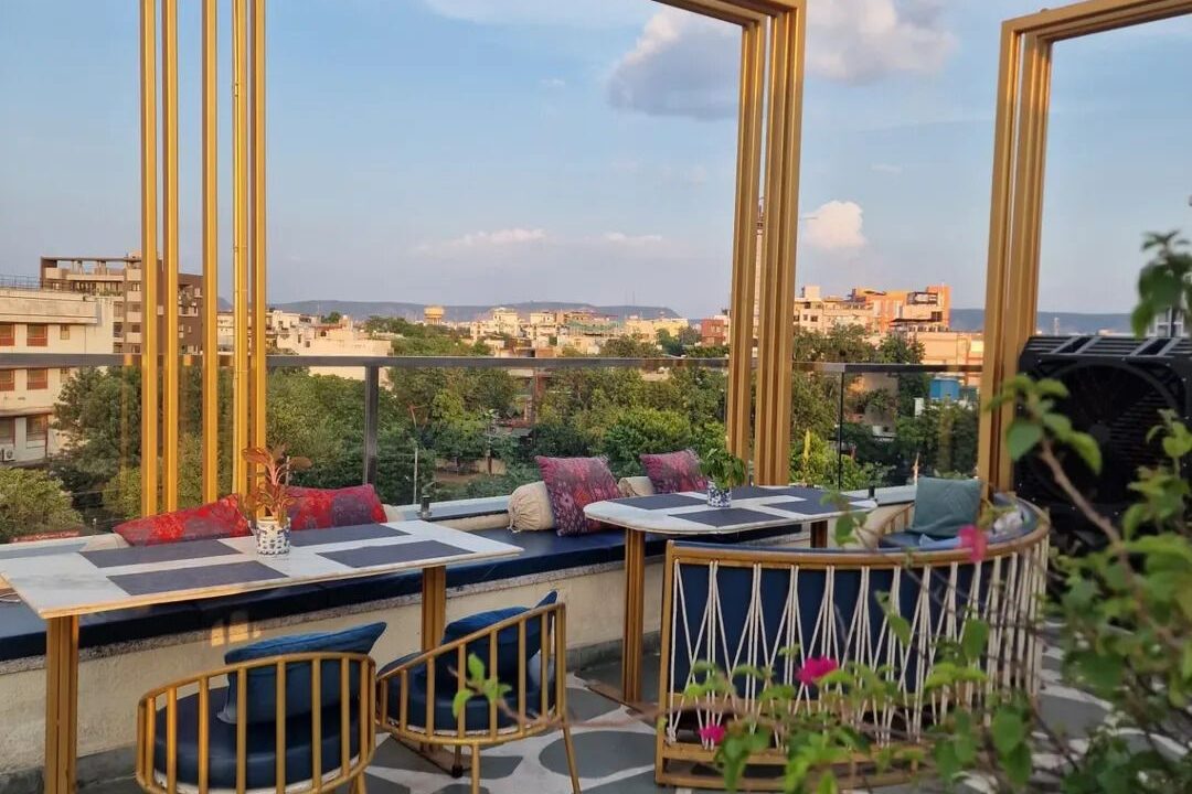 Rooftop terrace in daylight with a Jaipur city view at Nouba Restaurant and Rooftop Lounge, C-Scheme Jaipur