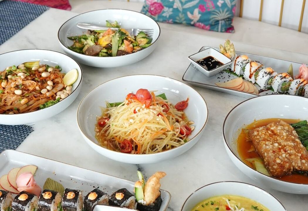 Shared table with pasta, sushi and curry at Nouba Restaurant and Rooftop Lounge, C-Scheme Jaipur