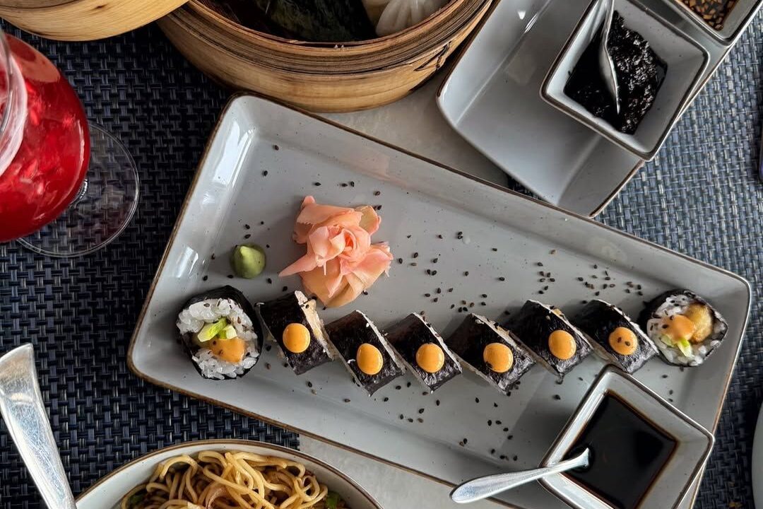 Sushi rolls on dark slate at Nouba Restaurant and Rooftop Lounge, C-Scheme Jaipur