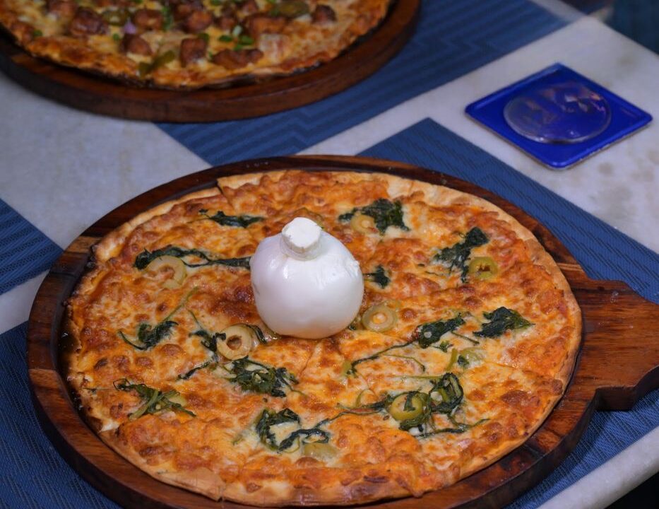 White pizza with a quenelle of cheese at Nouba Restaurant and Rooftop Lounge, C-Scheme Jaipur