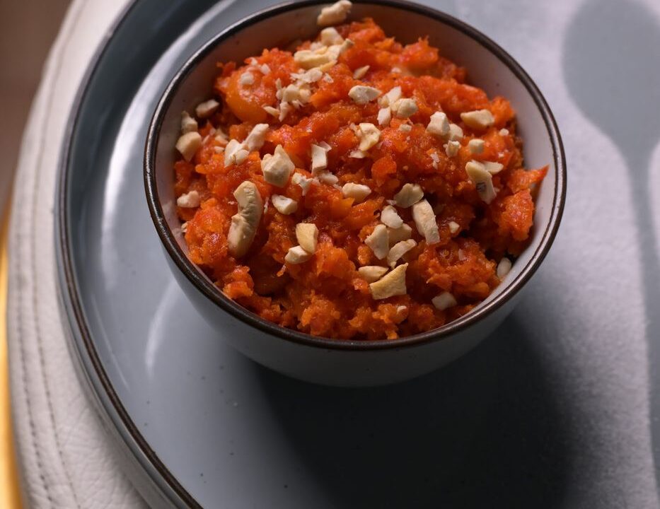 Gajar halwa with cashews in a dark bowl at Nouba Restaurant and Rooftop Lounge, C-Scheme Jaipur