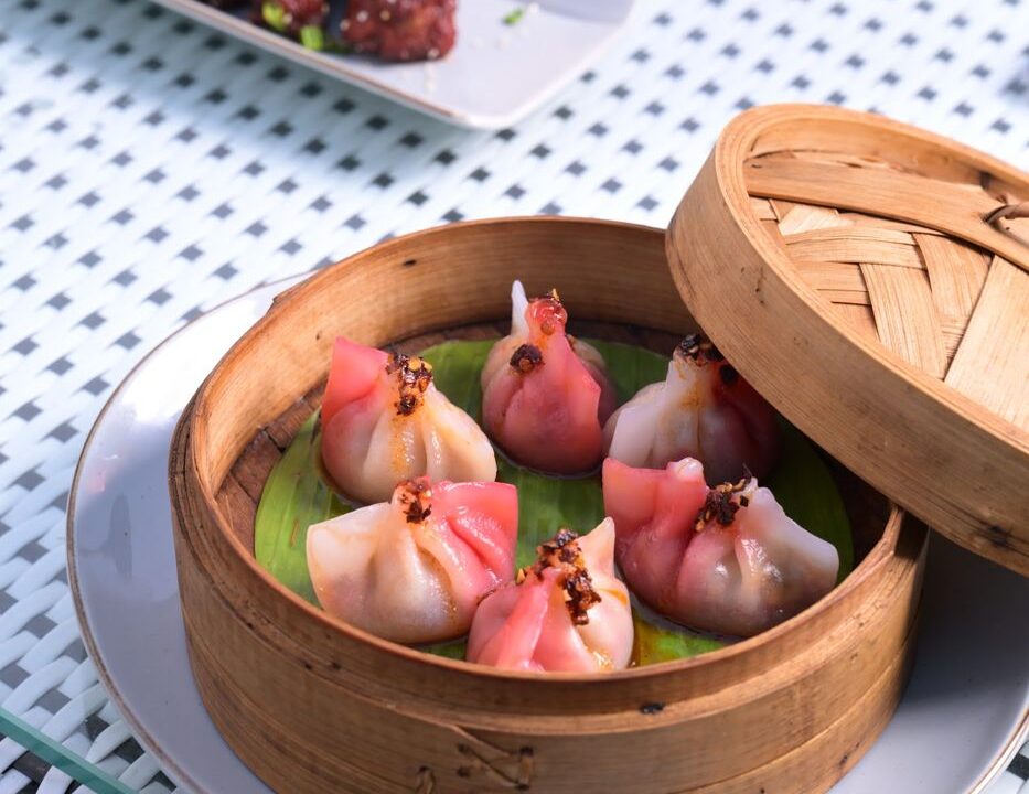 Pink dumplings in a bamboo steamer at Nouba Restaurant and Rooftop Lounge, C-Scheme Jaipur