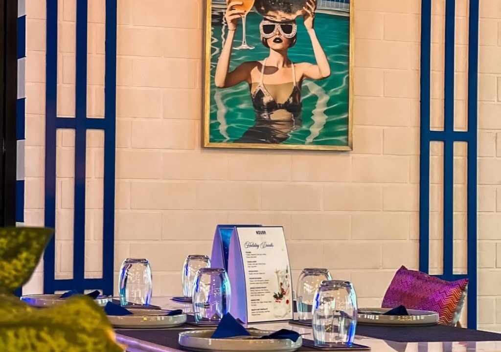 Interior with blue mural wall at Nouba Restaurant and Rooftop Lounge, C-Scheme Jaipur
