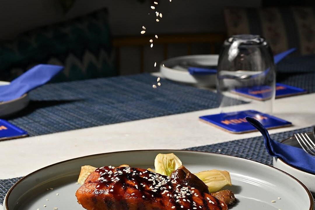 Glazed dessert on a dark plate at Nouba Restaurant and Rooftop Lounge, C-Scheme Jaipur