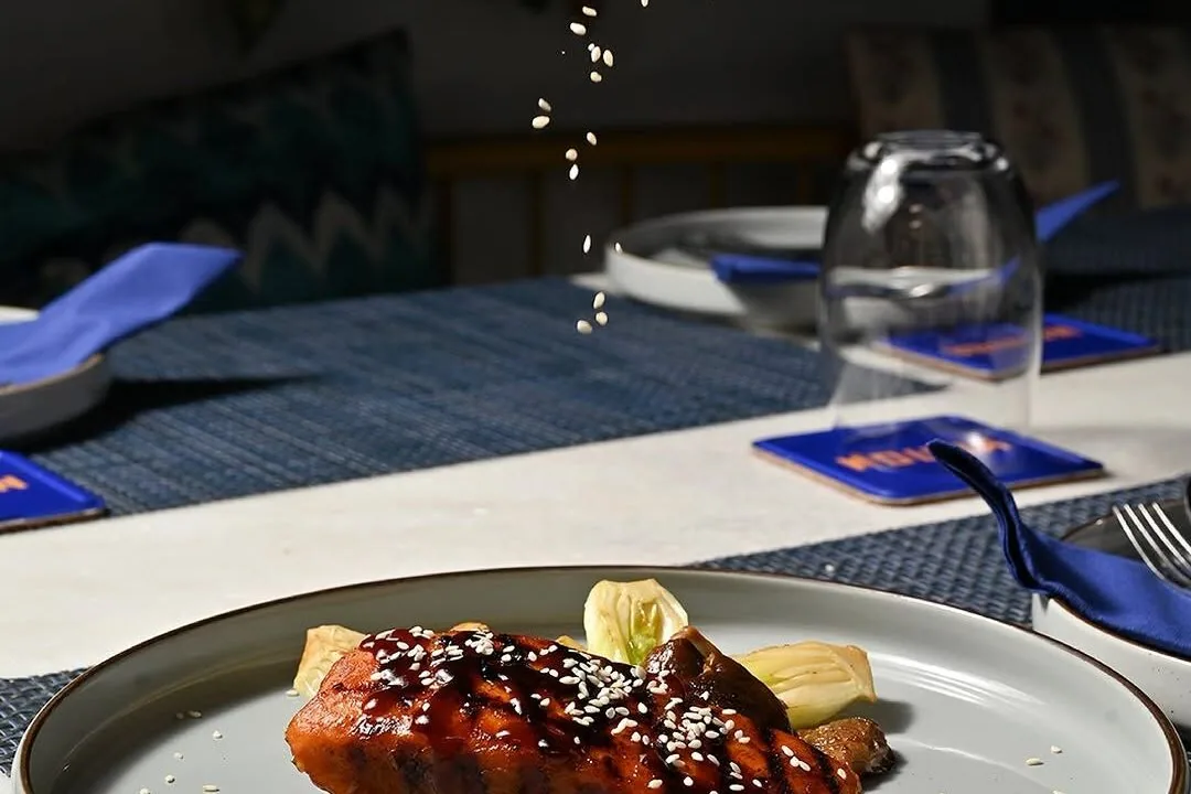 Glazed dessert on a dark plate at Nouba Restaurant and Rooftop Lounge, C-Scheme Jaipur
