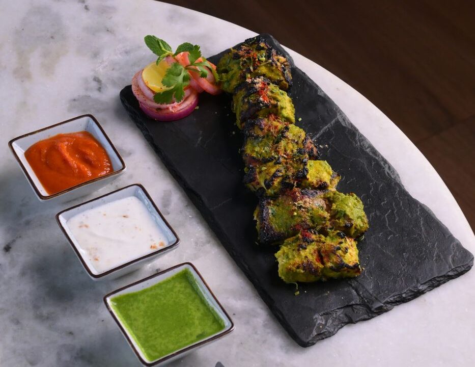 Avocado sushi roll on slate with dipping sauces at Nouba Restaurant and Rooftop Lounge, C-Scheme Jaipur