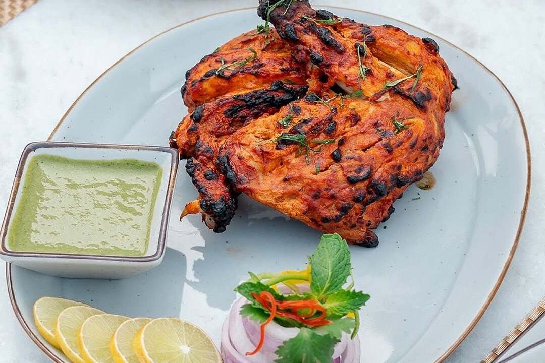 Whole tandoori chicken with mint chutney at Nouba Restaurant and Rooftop Lounge, C-Scheme Jaipur