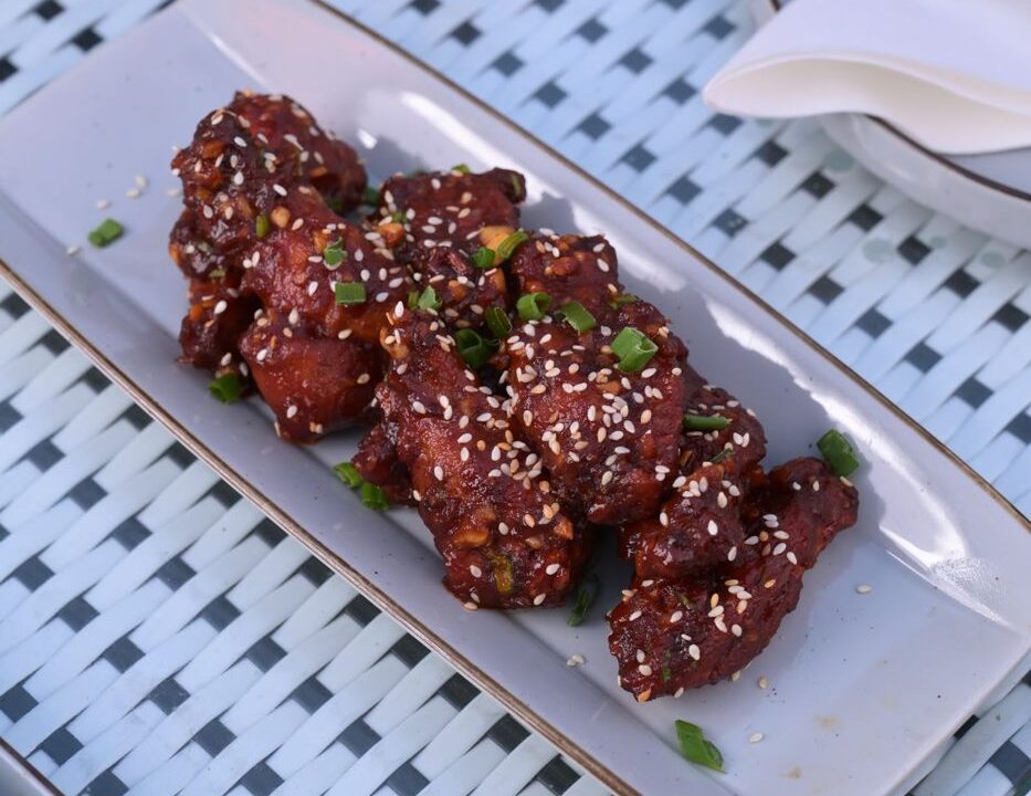 Dark glazed grilled chicken on a plate at Nouba Restaurant and Rooftop Lounge, C-Scheme Jaipur
