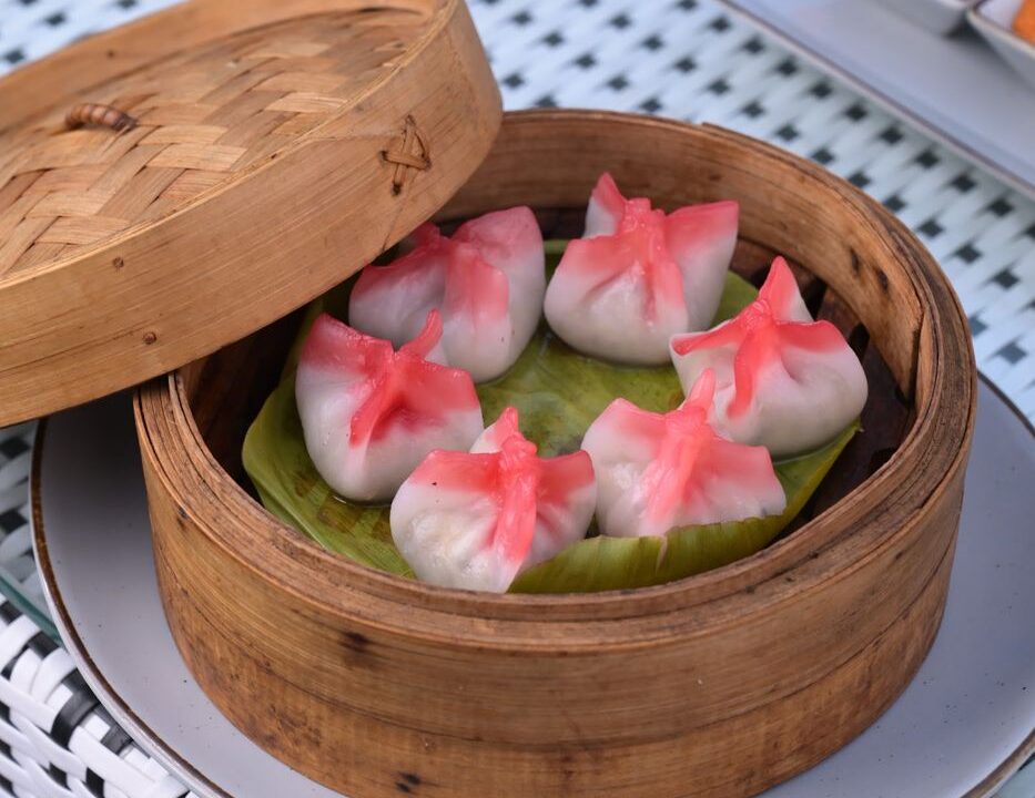Pink dumplings in a bamboo steamer at Nouba Restaurant and Rooftop Lounge, C-Scheme Jaipur