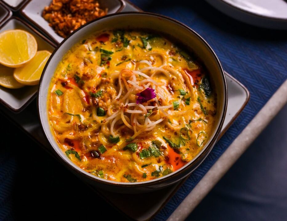 Yellow noodles in a copper pot at Nouba Restaurant and Rooftop Lounge, C-Scheme Jaipur