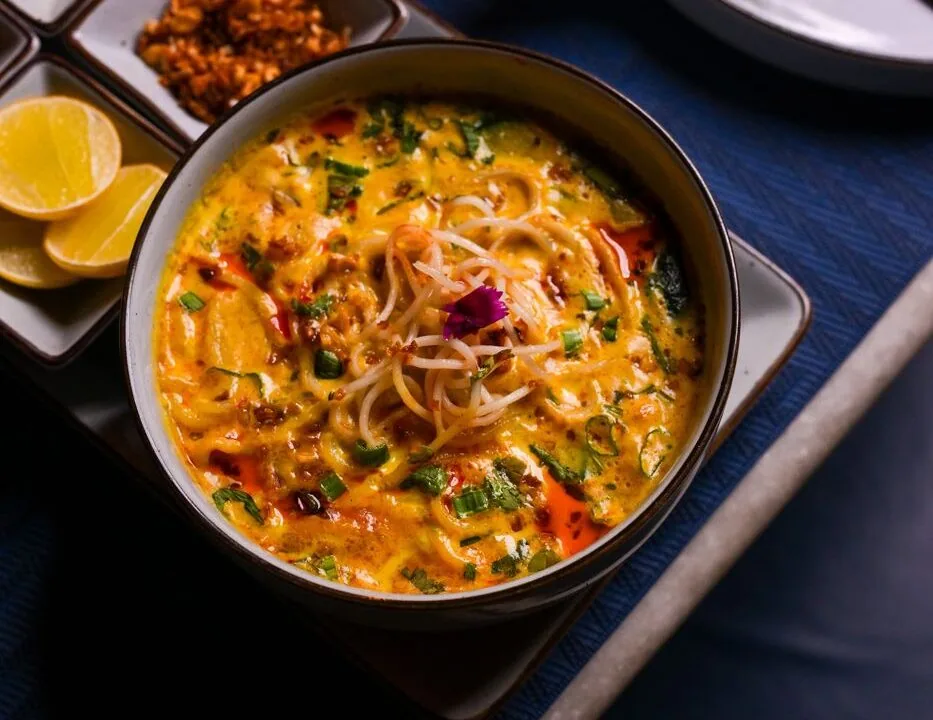 Yellow noodles in a copper pot at Nouba Restaurant and Rooftop Lounge, C-Scheme Jaipur