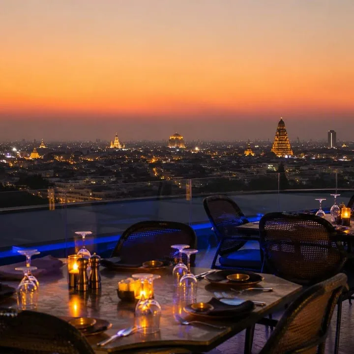 Rooftop tables set for dinner with Jaipur skyline view at Nouba Restaurant and Rooftop Lounge, C-Scheme Jaipur