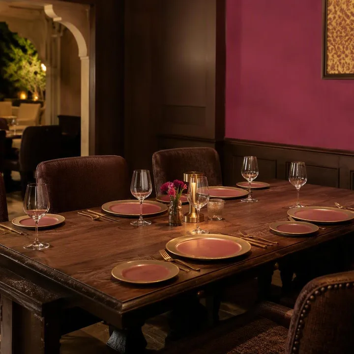 Family table on 3rd floor with brown and magenta decor at Nouba Restaurant and Rooftop Lounge, C-Scheme Jaipur