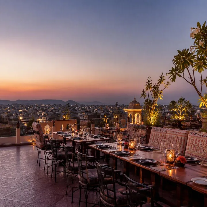 Rooftop tables set for a private group event with Jaipur skyline view at Nouba Restaurant and Rooftop Lounge, C-Scheme Jaipur