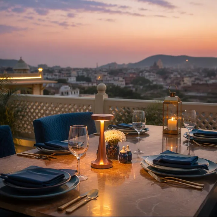 Rooftop table setup with skyline view and place settings at Nouba Restaurant and Rooftop Lounge, C-Scheme Jaipur