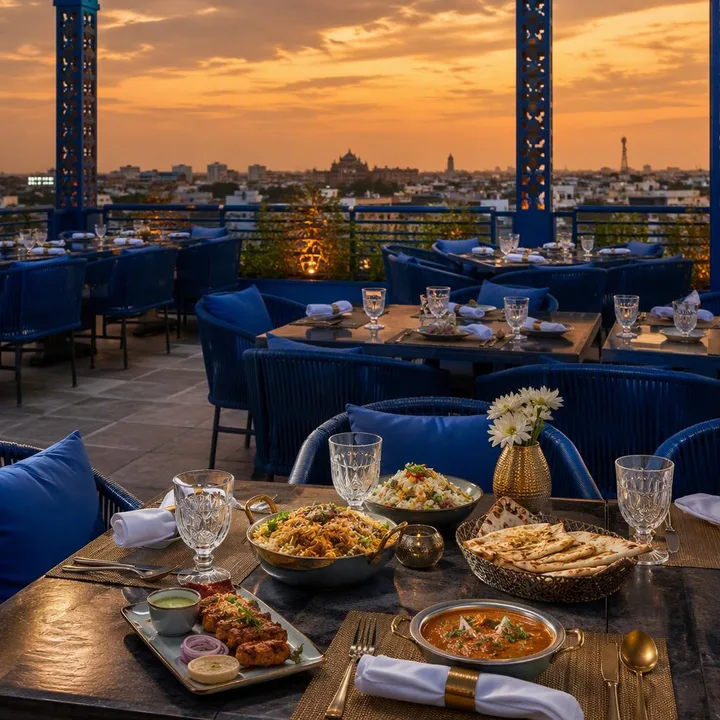 Rooftop tables with Jaipur skyline at dusk at Nouba Restaurant and Rooftop Lounge, C-Scheme Jaipur