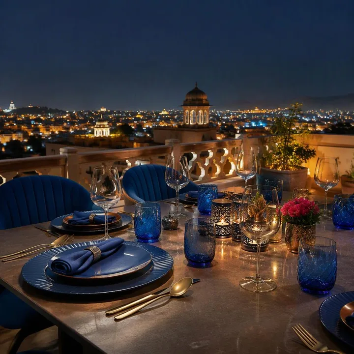 Rooftop table setup with Jaipur skyline at dusk at Nouba Restaurant and Rooftop Lounge, C-Scheme Jaipur