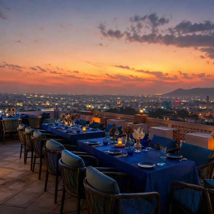 Rooftop tables set for large family group with Jaipur skyline view at Nouba Restaurant and Rooftop Lounge, C-Scheme Jaipur