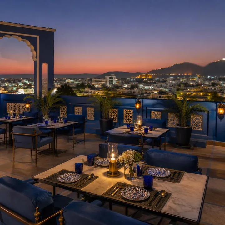 Rooftop tables with Jaipur skyline view at sunset at Nouba Restaurant and Rooftop Lounge, C-Scheme Jaipur
