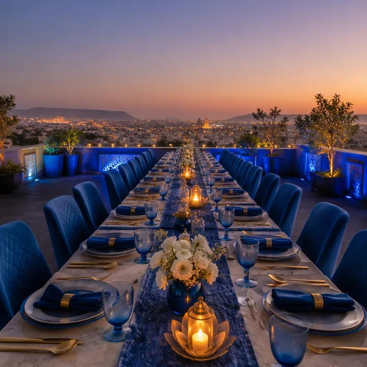 Rooftop dining setup with tables for large groups and Jaipur skyline view at Nouba Restaurant and Rooftop Lounge, C-Scheme Jaipur