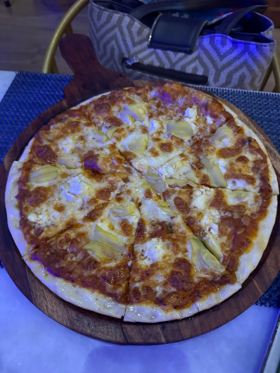 Artichoke and goat cheese pizza, vegetarian, at Nouba Jaipur